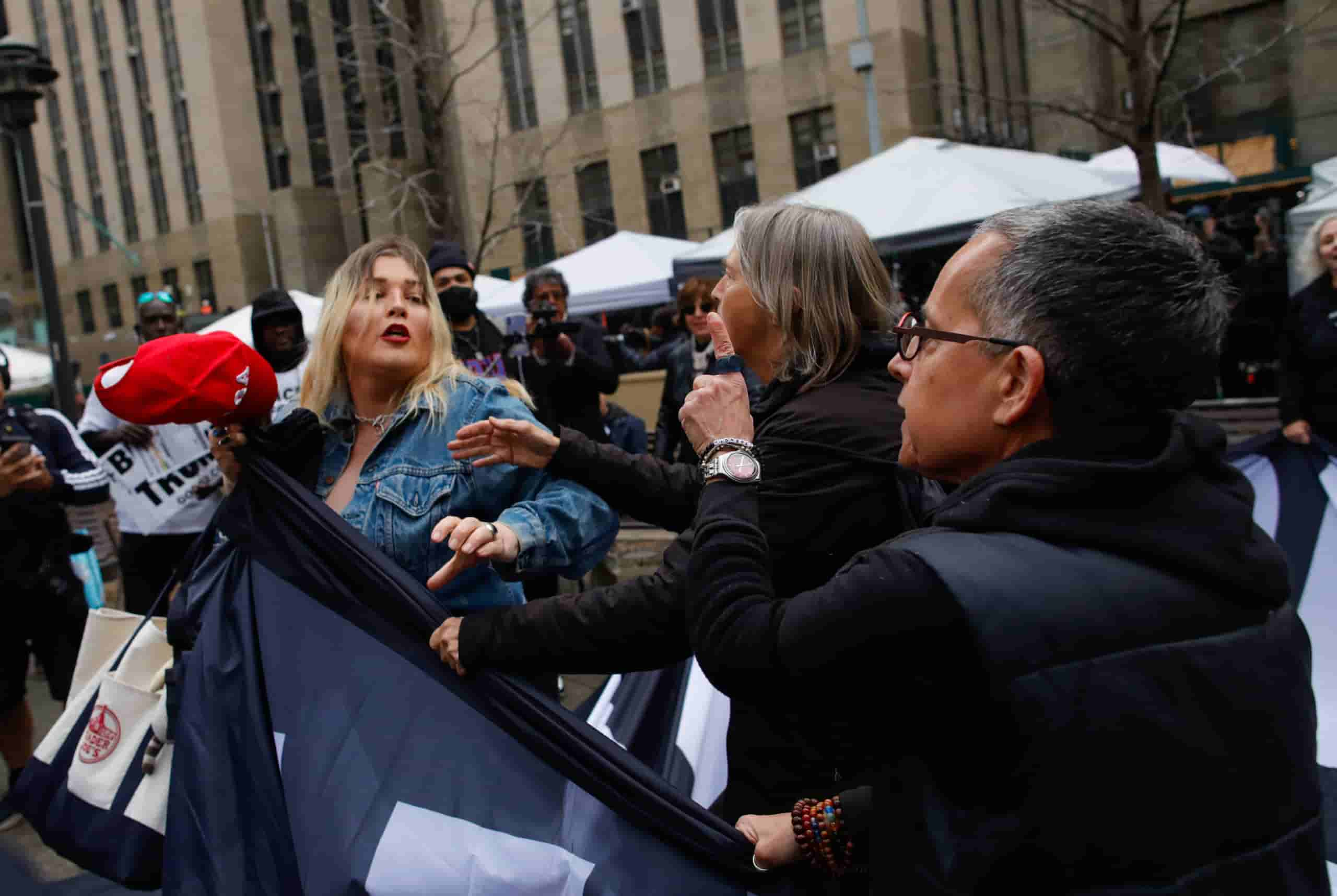 Trump protestors clash with Pro-trump supporters outside the Manhattan courthouse over Trump indictment.